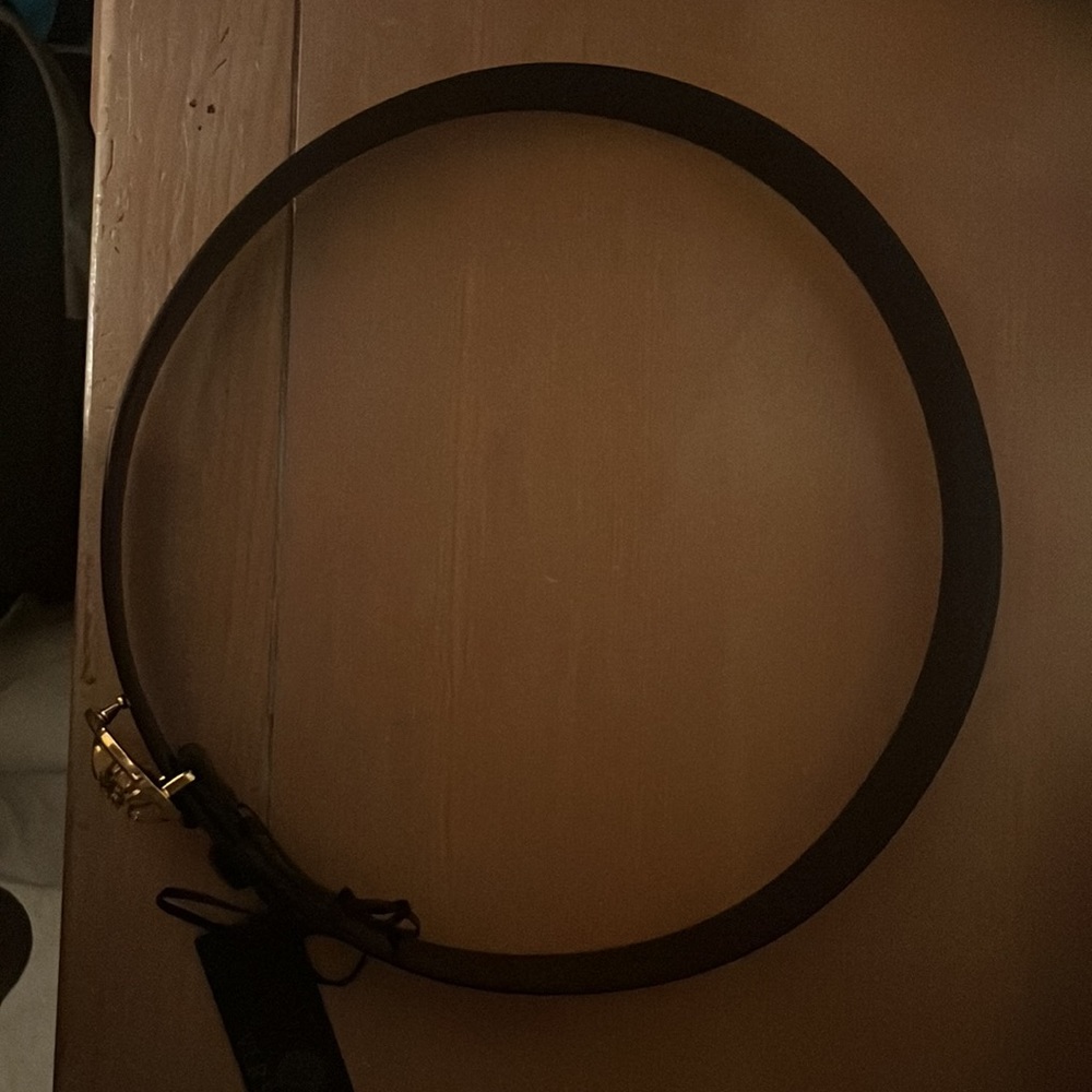 Black Versace belt with a gold buckle